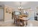 Inviting dining area with a wooden table, comfortable chairs, and kitchen access at 1560 Bel Keene Dr, Clearwater, FL 33756