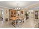Inviting dining room featuring a wooden table, chairs and a large china cabinet at 1560 Bel Keene Dr, Clearwater, FL 33756