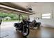 Spacious garage featuring a clean epoxy floor and enough space for multiple motorcycles at 1560 Bel Keene Dr, Clearwater, FL 33756