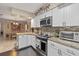 Modern kitchen featuring granite countertops, stainless steel appliances, and open layout at 1560 Bel Keene Dr, Clearwater, FL 33756