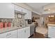 Modern kitchen featuring granite countertops, stainless steel appliances, and mosaic backsplash at 1560 Bel Keene Dr, Clearwater, FL 33756