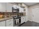 Close up of modern kitchen with stainless steel appliances and granite countertops at 1560 Bel Keene Dr, Clearwater, FL 33756