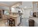 Modern kitchen featuring granite countertops, stainless steel appliances, and breakfast bar at 1560 Bel Keene Dr, Clearwater, FL 33756