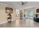 Bright living room with tile floors and sliding glass doors to the lanai at 1560 Bel Keene Dr, Clearwater, FL 33756