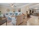 Spacious living room with tile floors, comfortable seating, and an open layout at 1560 Bel Keene Dr, Clearwater, FL 33756