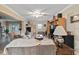 Comfortable living room featuring a fireplace, ceiling fan, and neutral decor at 1560 Bel Keene Dr, Clearwater, FL 33756