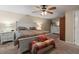 Comfortable main bedroom with a ceiling fan and ample closet space at 1560 Bel Keene Dr, Clearwater, FL 33756