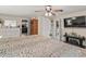 Spacious main bedroom features a ceiling fan, television and access to the bathroom at 1560 Bel Keene Dr, Clearwater, FL 33756