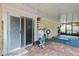 Enclosed patio area with brick flooring and view to backyard at 1560 Bel Keene Dr, Clearwater, FL 33756