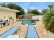Enjoy the in-ground pool and spa in this backyard oasis, perfect for relaxing and entertaining at 1560 Bel Keene Dr, Clearwater, FL 33756