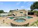 Backyard pool and spa with surrounding brick patio at 1560 Bel Keene Dr, Clearwater, FL 33756