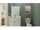 Simple bathroom with single vanity, toilet, and calming decor at 18429 Serene Lake Loop, Lutz, FL 33548