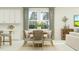 Bright dining room with wood table and chairs, and access to kitchen at 18429 Serene Lake Loop, Lutz, FL 33548