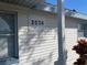 A close-up of the house number displayed on the home's exterior at 2036 Melody Dr, Holiday, FL 34691