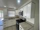 Well-equipped kitchen with stainless steel appliances and granite countertops at 2036 Melody Dr, Holiday, FL 34691