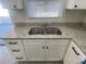 New kitchen sink with granite countertop and white cabinets at 2036 Melody Dr, Holiday, FL 34691