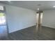 Spacious living room with updated flooring and plenty of natural light at 2036 Melody Dr, Holiday, FL 34691