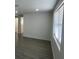 Inviting living room featuring modern flooring and a bright, airy atmosphere at 2036 Melody Dr, Holiday, FL 34691