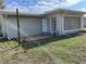 Exterior of home with a well-maintained lawn at 2051 High Ridge Dr, Clearwater, FL 33763