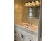 Bright bathroom featuring white vanity with modern fixtures and decorative mirror at 2051 High Ridge Dr, Clearwater, FL 33763