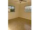 Empty room featuring neutral walls and tile flooring at 2051 High Ridge Dr, Clearwater, FL 33763