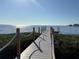 Wooden dock extending over the waterfront, offering peaceful water access at 244 S Beach Dr, Tarpon Springs, FL 34689