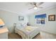 Serene bedroom with a bed, soft lighting, and a side table; perfect for relaxation and restful nights at 36852 Kimela Ave, Zephyrhills, FL 33542