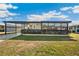 Charming single-story home with a covered carport, screened-in porch, and well-maintained front yard at 36852 Kimela Ave, Zephyrhills, FL 33542