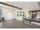 Spacious covered patio with steps, railing, and an entrance door on the side of the home at 36852 Kimela Ave, Zephyrhills, FL 33542