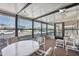 Enclosed sunroom showcasing ample natural light, table with chairs, and comfortable seating area for relaxing at 36852 Kimela Ave, Zephyrhills, FL 33542