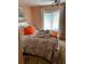 Bedroom with seashell bedspread, window and light-colored carpet at 3730 42Nd S Way # K, St Petersburg, FL 33711