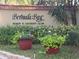 Entrance to the Bermuda Bay Beach & Racquet Club community, with lush landscaping at 3730 42Nd S Way # K, St Petersburg, FL 33711