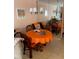 Dining area with a round table and chairs, featuring a mirrored wall that enhances the sense of space at 3730 42Nd S Way # K, St Petersburg, FL 33711