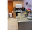 Kitchen featuring granite countertops, light wood cabinets, and modern appliances at 3730 42Nd S Way # K, St Petersburg, FL 33711