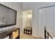 Bedroom nook with black and white patterned wallpaper and storage at 3852 Sorrel Vine Dr, Wesley Chapel, FL 33544