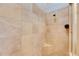 Tiled shower featuring a built-in seat, a shower head, and a glass door at 3852 Sorrel Vine Dr, Wesley Chapel, FL 33544