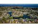 Expansive aerial view showcasing waterfront homes along a picturesque bay with views of distant coastline at 4601 Carson Ne St, St Petersburg, FL 33703