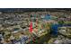 Sweeping aerial view of a waterfront community, revealing canal-side homes and lush greenery at 4601 Carson Ne St, St Petersburg, FL 33703