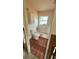 Cozy bathroom featuring tiled walls, toilet and a bathtub for a comfortable experience at 4601 Carson Ne St, St Petersburg, FL 33703