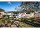Charming single-story home featuring a well-kept lawn, updated windows, and a white picket fence at 4601 Carson Ne St, St Petersburg, FL 33703