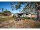 A cozy single-story house with new windows, situated on a verdant, tree-shaded lot at 4601 Carson Ne St, St Petersburg, FL 33703
