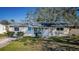 Charming single-story home featuring a well-maintained lawn, inviting entrance, and neutral exterior paint at 4601 Carson Ne St, St Petersburg, FL 33703