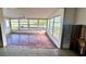 Bright sunroom with many windows offering scenic water views, perfect for relaxing at 4601 Carson Ne St, St Petersburg, FL 33703