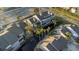 Stunning aerial view of property showcasing mature landscaping, pond, and proximity to the city at 4777 Duhme Rd # 1A, St Petersburg, FL 33708