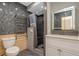 Contemporary bathroom features a stand up shower, modern fixtures, and gray tiling at 4777 Duhme Rd # 1A, St Petersburg, FL 33708