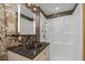 Updated bathroom vanity with modern fixtures and bright shower with integrated shelving at 4777 Duhme Rd # 1A, St Petersburg, FL 33708