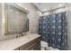 Beautifully renovated bathroom with marble tile and modern fixtures at 4777 Duhme Rd # 1A, St Petersburg, FL 33708