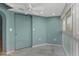 This bedroom has tile flooring and a large blue door at 4777 Duhme Rd # 1A, St Petersburg, FL 33708