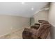 Cozy bonus room featuring plush reclining seating and soft carpet, perfect for movie nights or relaxation at 4777 Duhme Rd # 1A, St Petersburg, FL 33708