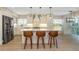 Stylish kitchen featuring a marble island, pendant lighting, stainless steel appliances, and breakfast bar at 4777 Duhme Rd # 1A, St Petersburg, FL 33708